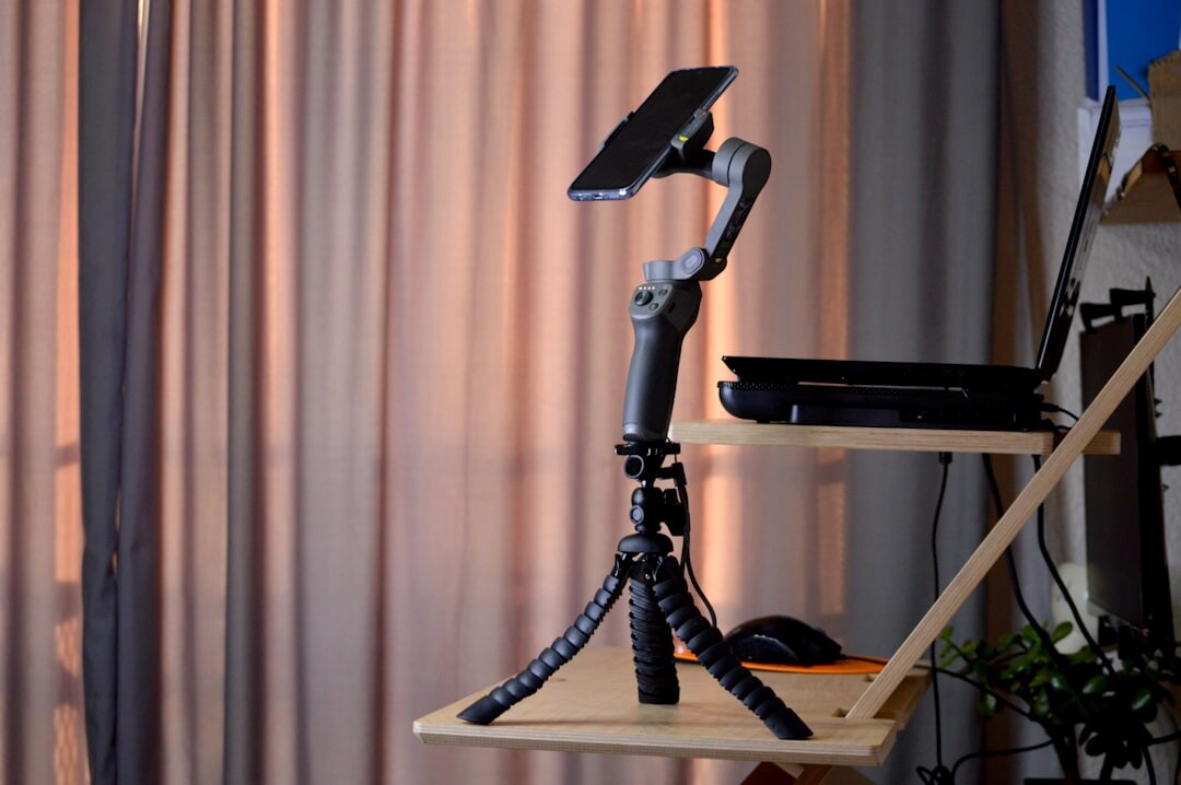 Live streaming video setup with camera, tripod and laptop encoder